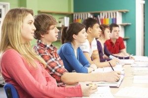 Teenage Students Studying In Classroom